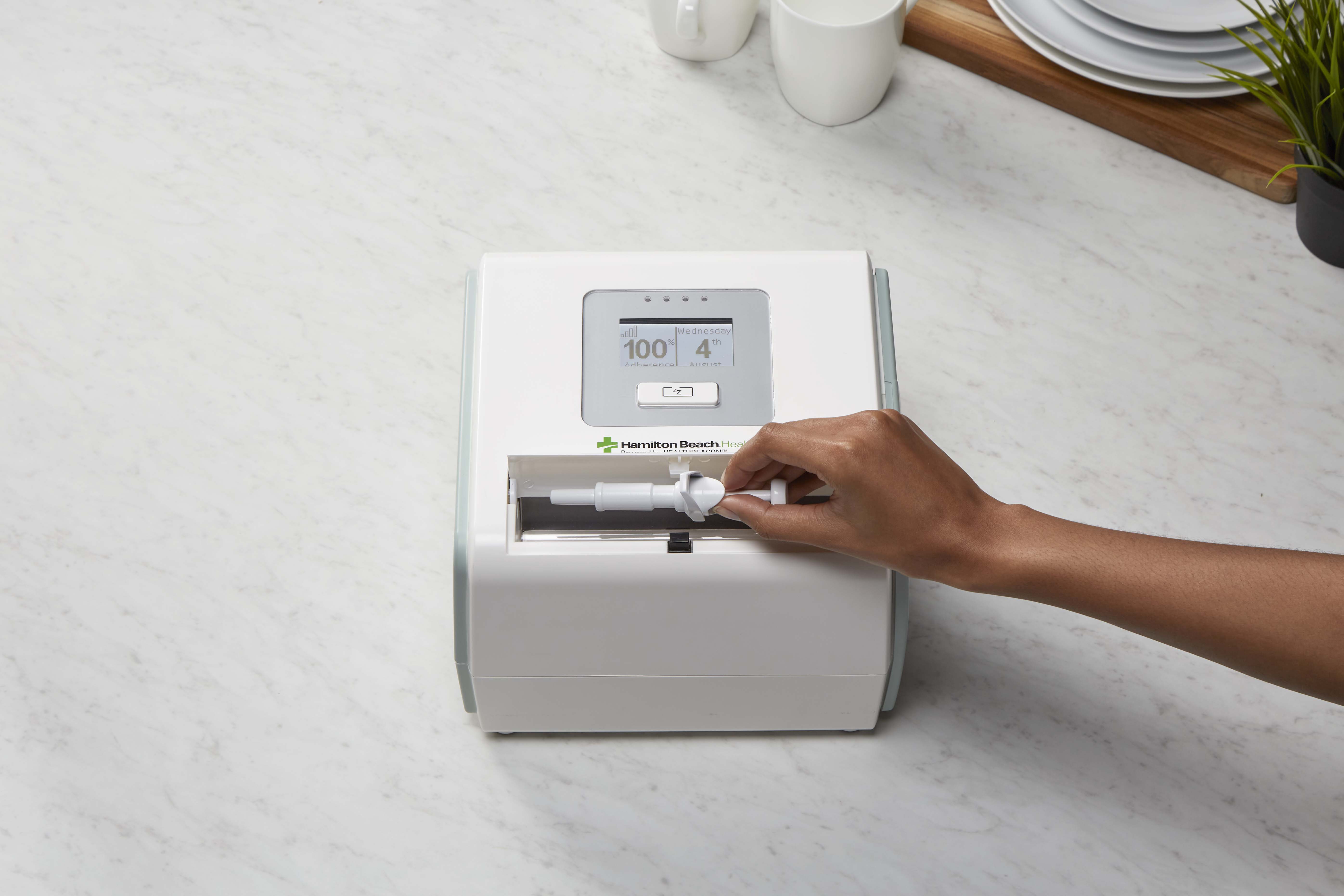 Placing syringe in HealthBeacon device