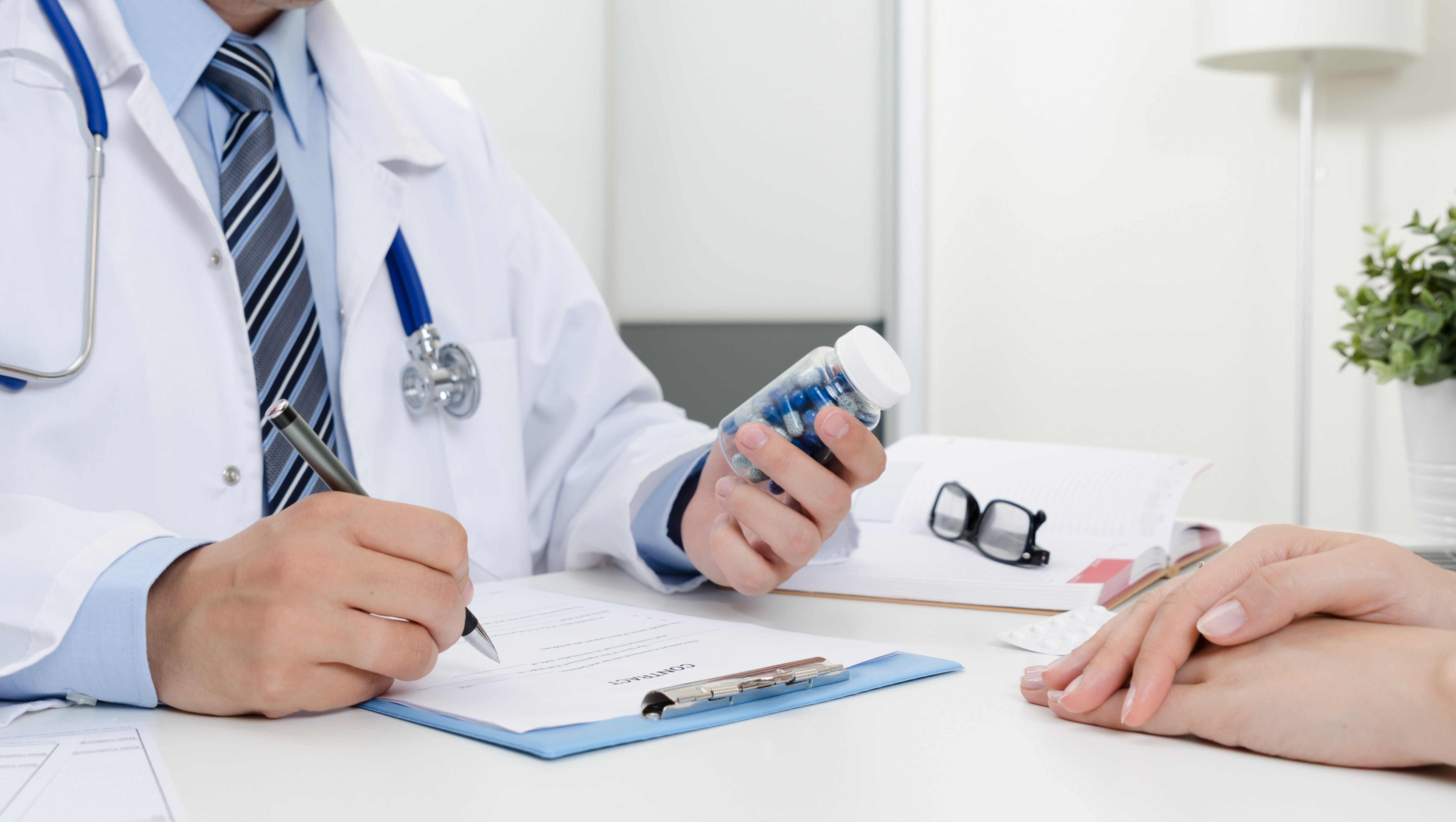 Doctor writing prescription