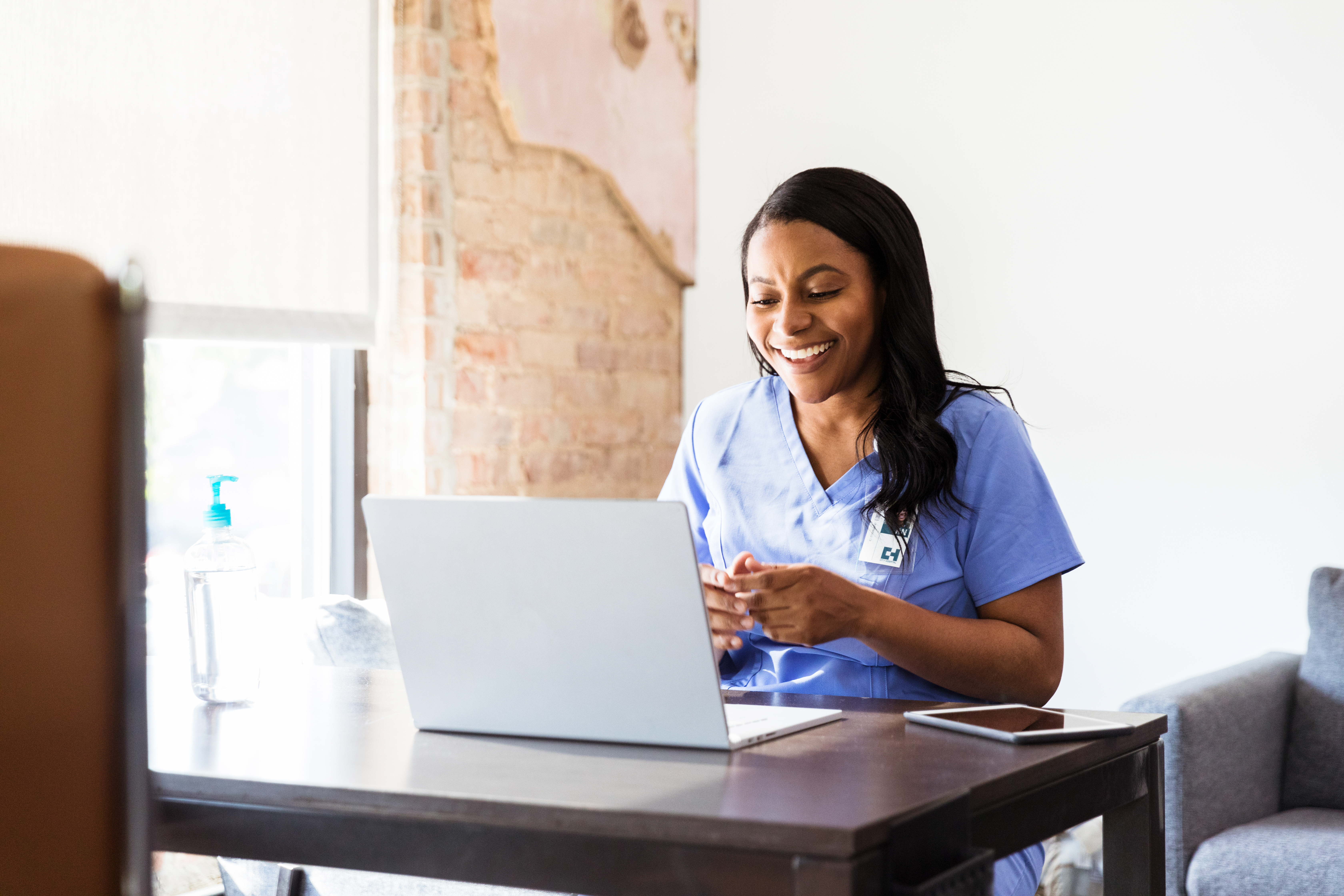 Woman smiling at computer