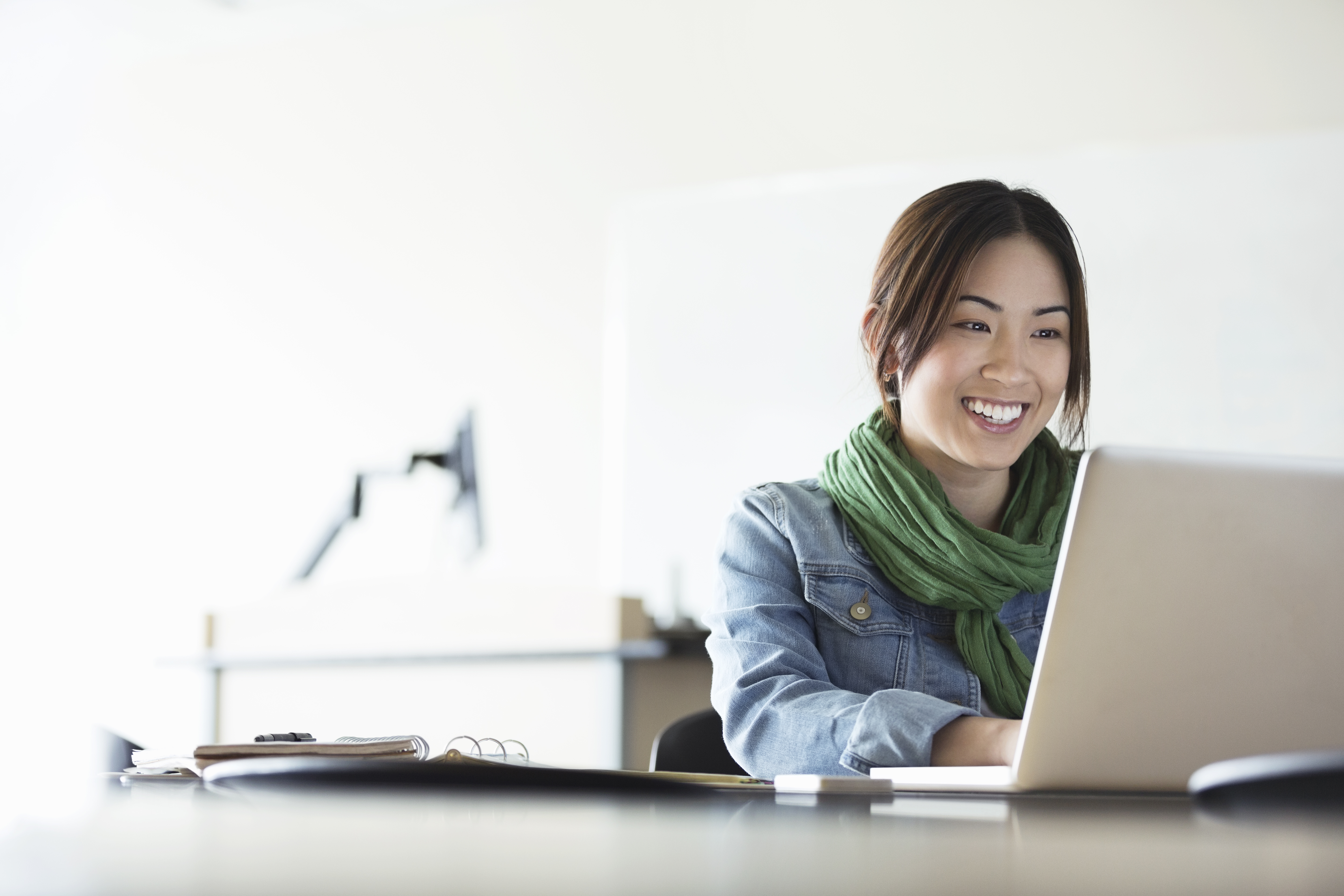 Woman smiling with laptop