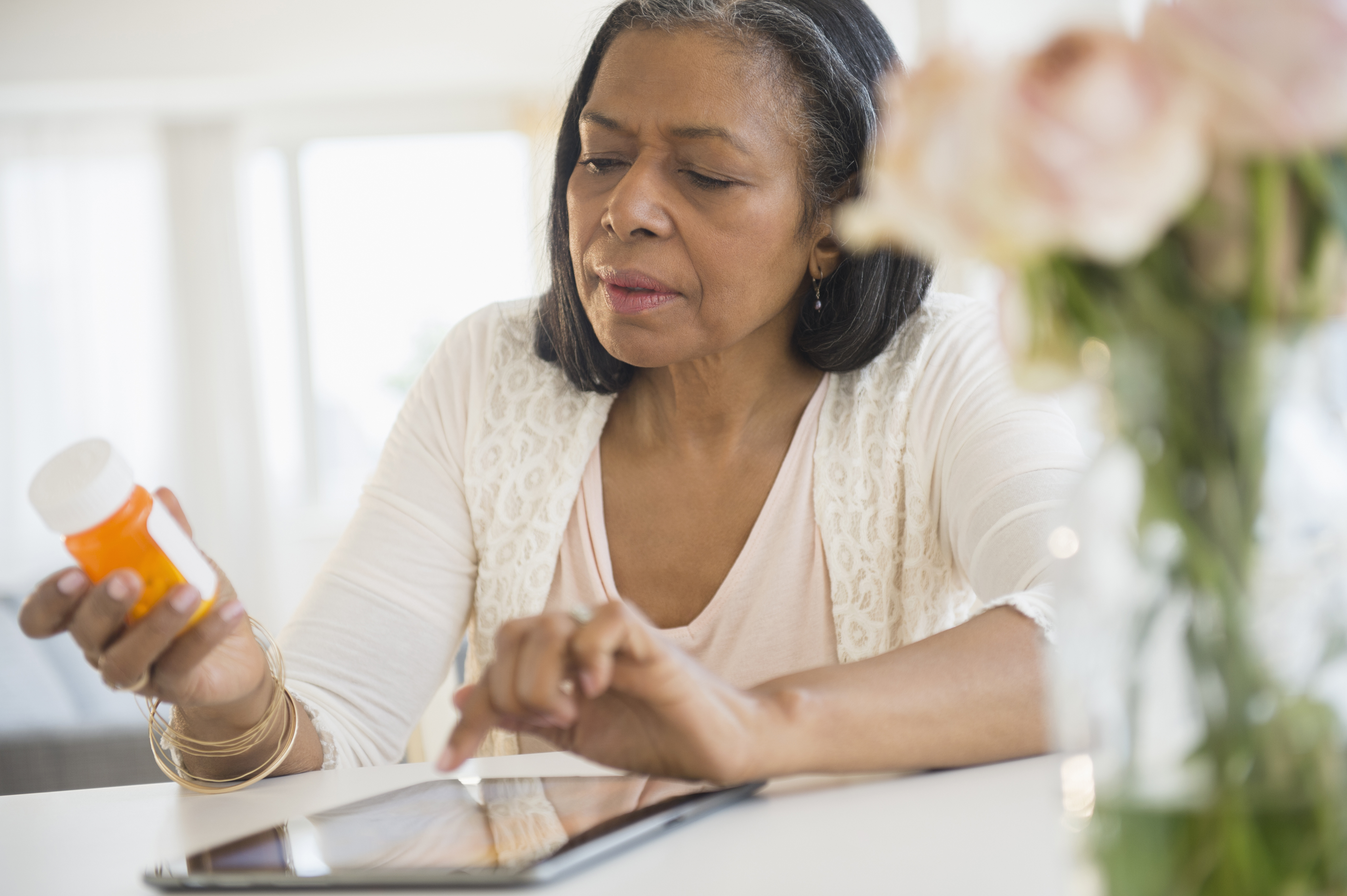 Woman with prescription bottle