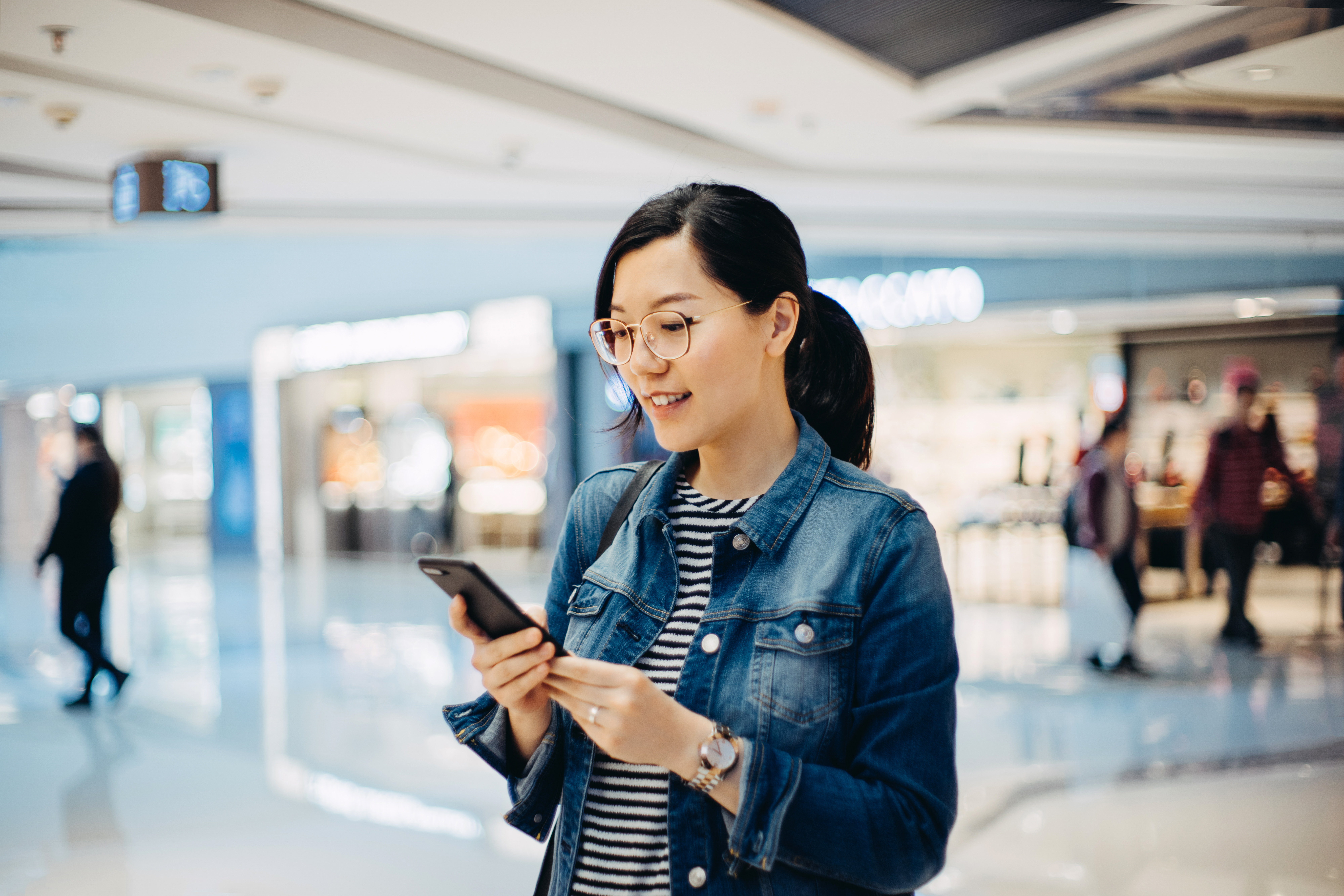 woman smiling at phone