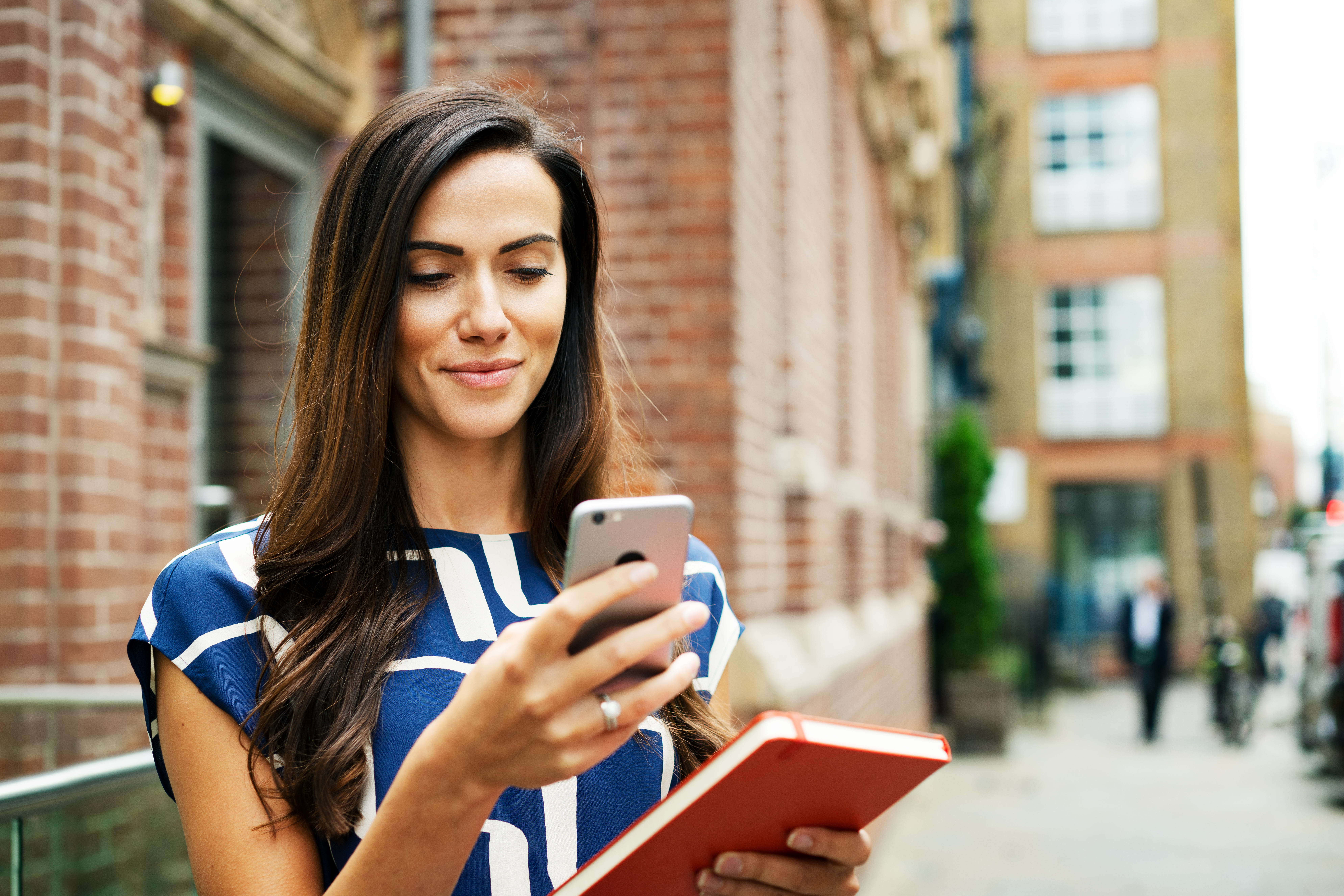 woman with phone on street