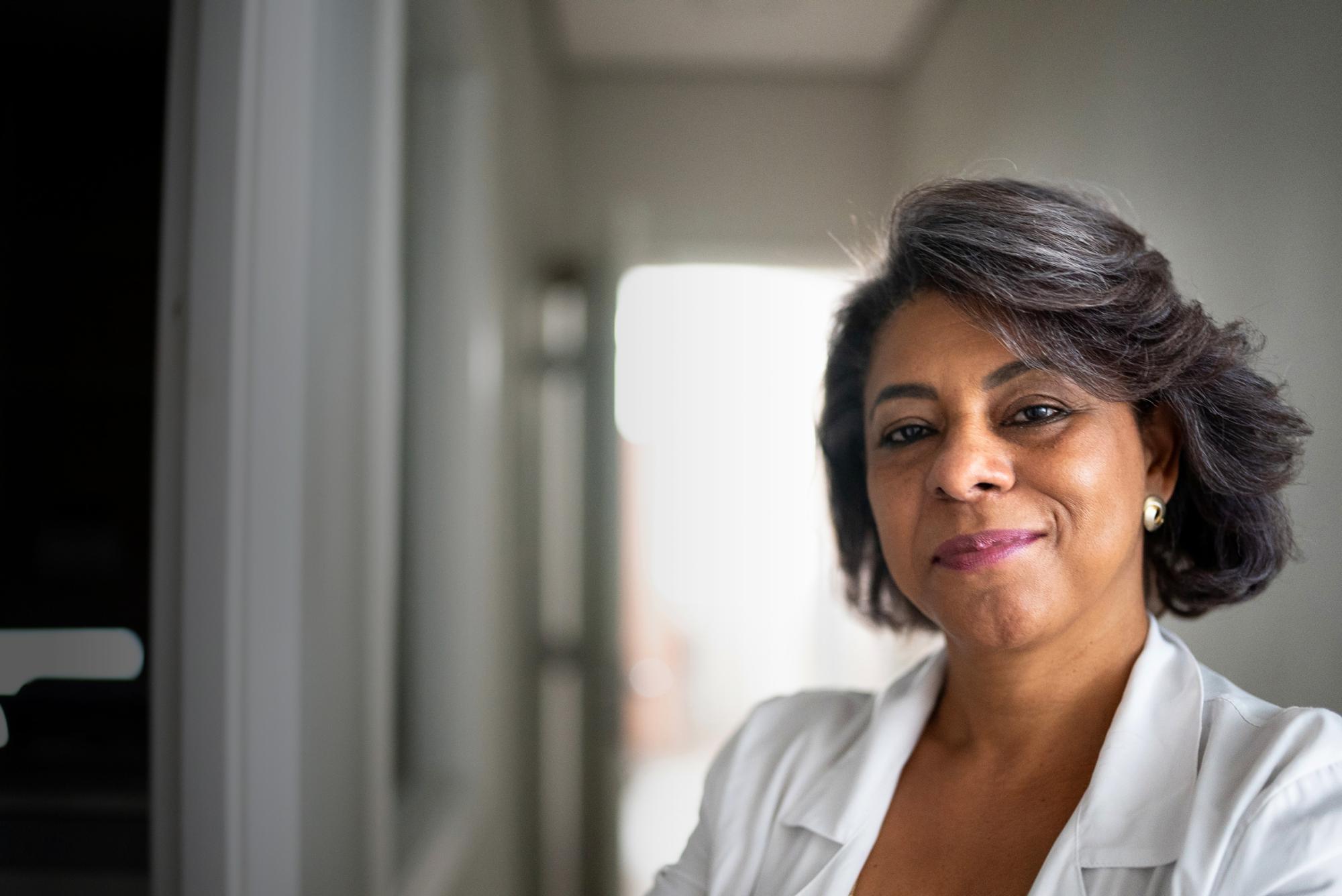 A physician smiles