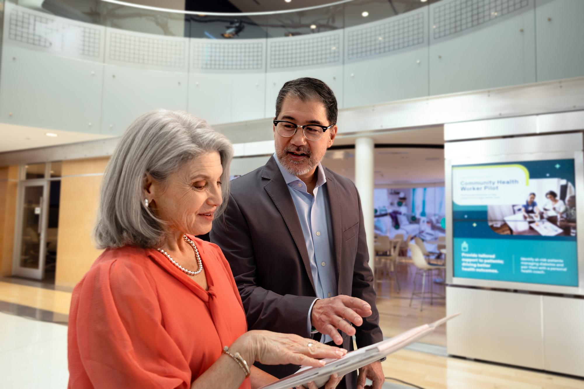 Man and woman looking at a document