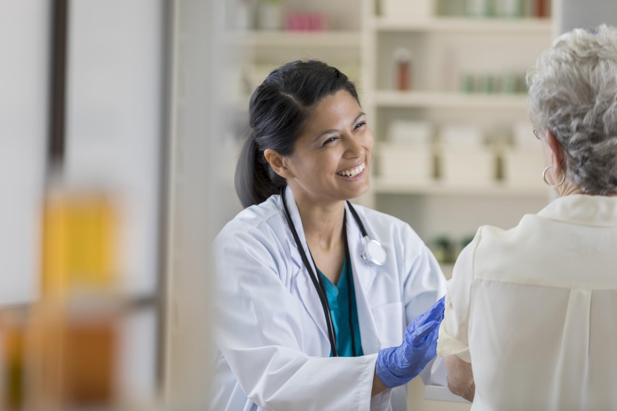 Doctor smiling at patient