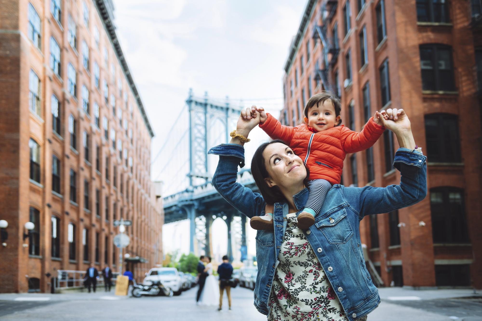 Woman and baby in city