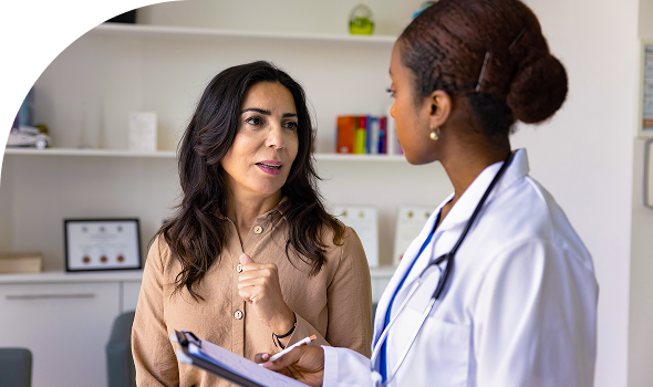Woman speaking to doctor