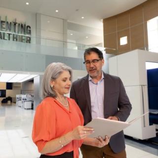 Man and woman reviewing a document