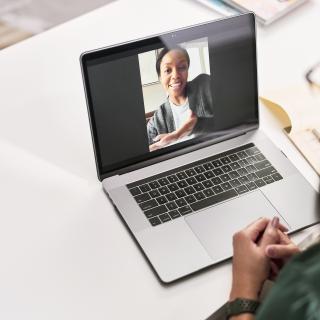 woman using laptop on video call