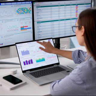woman at desk using laptop