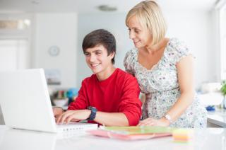 Mother and son with laptop computer. 